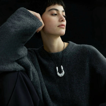 Model wearing a silver Crescent Pendant Necklace, great for parties, weddings, and dates.