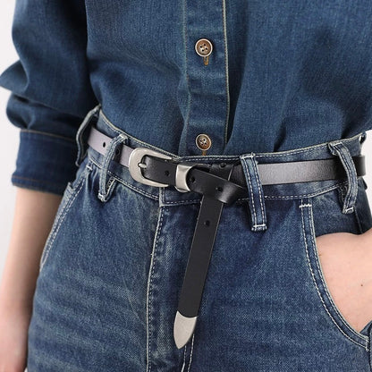 Model wearing the black leather belt with blue denim jeans.