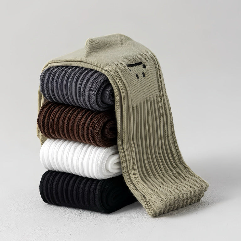 Stack of five pairs of cotton-polyester slouch socks in olive green, gray, brown, white, and black.