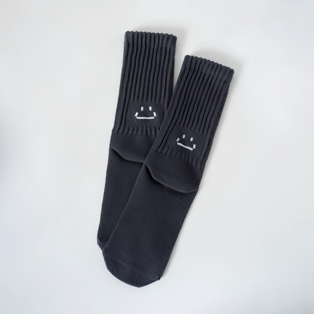 Angled view of Smile Slouch Socks in gray, great for daily wear and lounging.