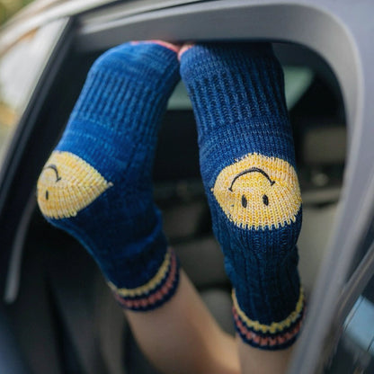 Dark blue smiley knitted socks made of soft cotton blend yarn, cozy for daily wear.