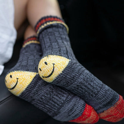 Dark grey smiley knitted socks made of soft cotton blend yarn, cozy for daily wear.