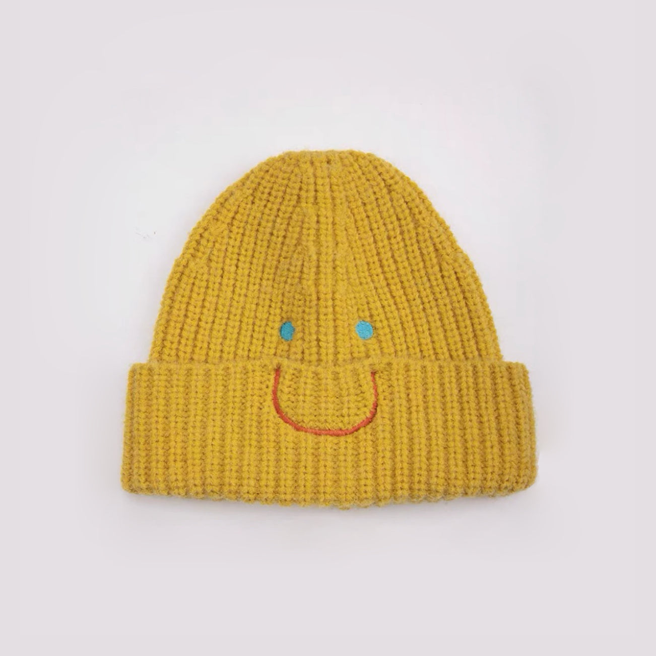 Front view of Smiley Ribbed Knit Beanie in yellow. Bright energetic hue in a breathable, soft-knit texture.
