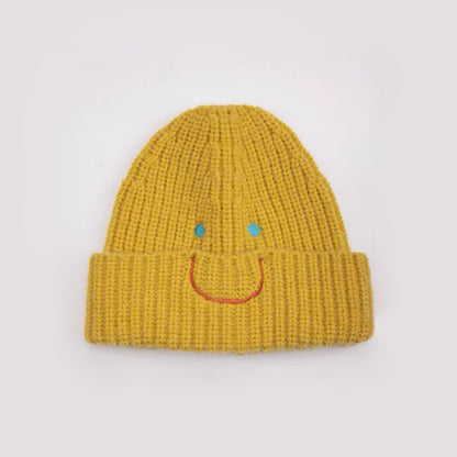 Front view of Smiley Ribbed Knit Beanie in yellow. Bright energetic hue in a breathable, soft-knit texture.