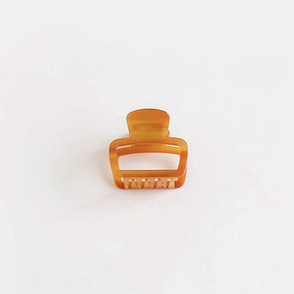 Glossy brown square hair claw on clean background, ideal for a casual daily look.