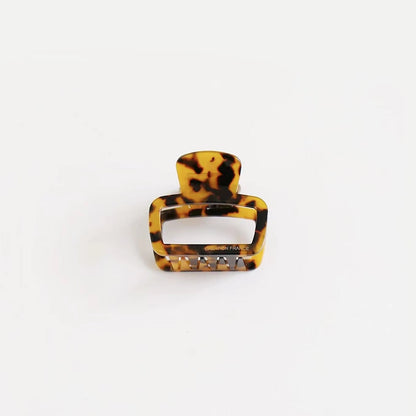 Dark leopard square clip on a white background, perfect for professional office looks. 