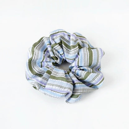 Folded view of Stripe Dream Scrunchie in blue, ideal for quick updos and ponytails.