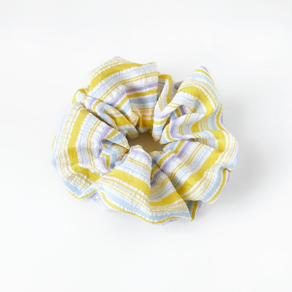 Close-up of Stripe Dream Scrunchie in yellow, easy for workdays and special occasions.