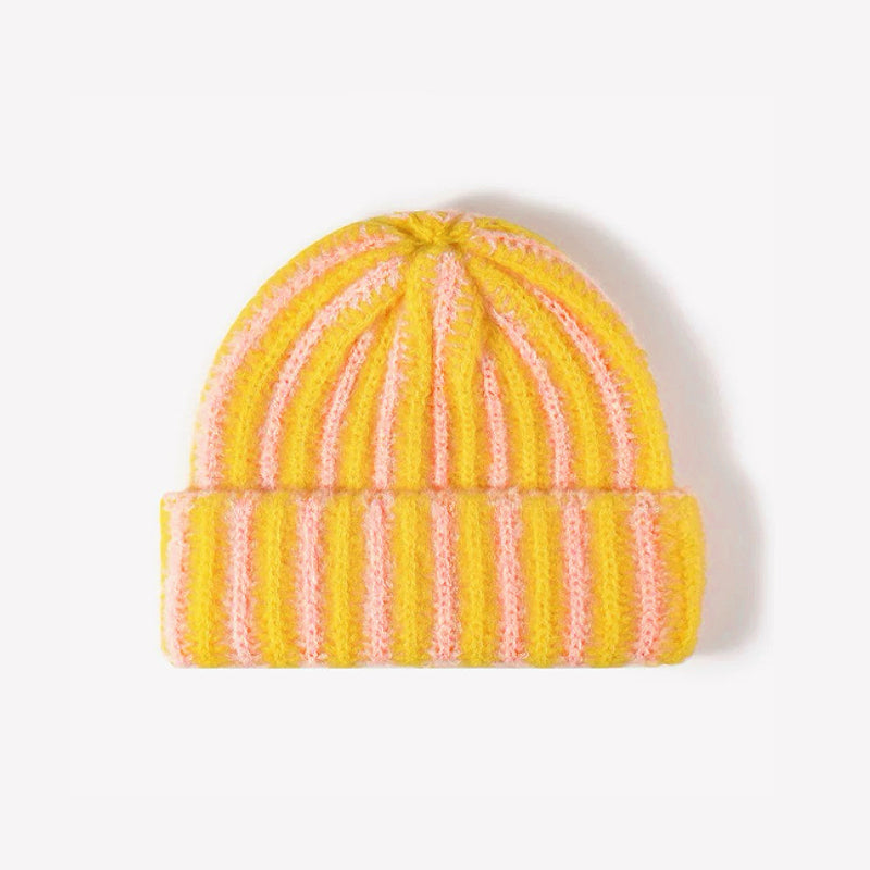 Front view of Striped Fluffy Knit Beanie in yellow pink. Versatile headwear for everyday winter layering.