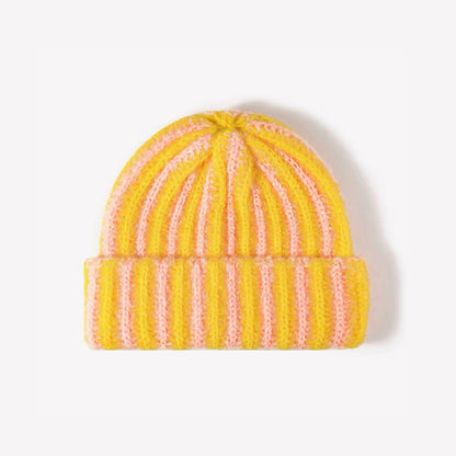 Front view of Striped Fluffy Knit Beanie in yellow pink. Versatile headwear for everyday winter layering.