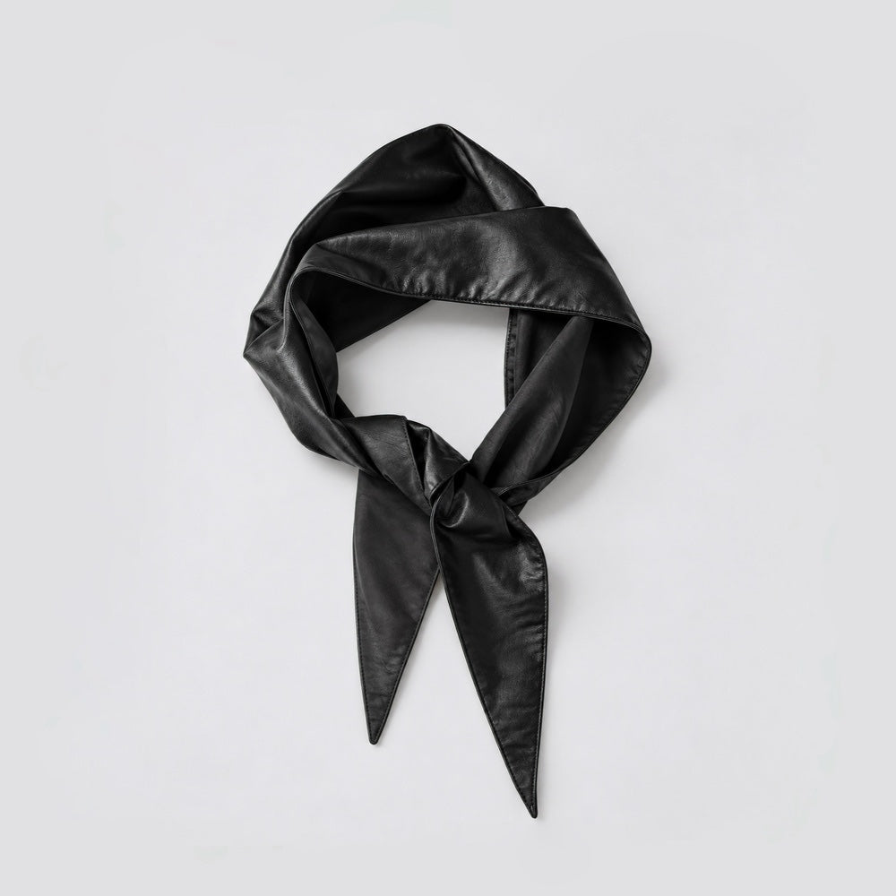 Front view of a black vegan leather triangle scarf tied in a knot on a white background.