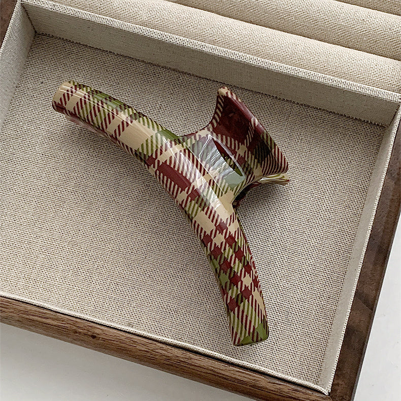 Angled view of  arc Tartan Elegance Hair Claw, great for everyday styling and gifting.