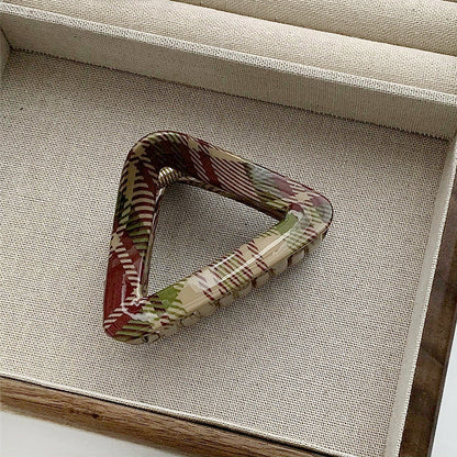 Angled view of triangle Tartan Elegance Hair Claw, easy for workdays and special occasions.