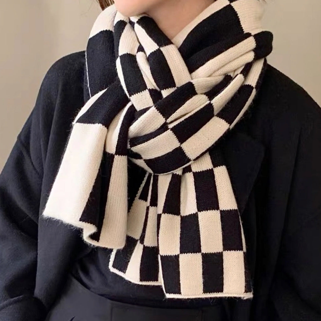 Model wearing a plaid wool scarf in gray, ideal for daily wear and travel.