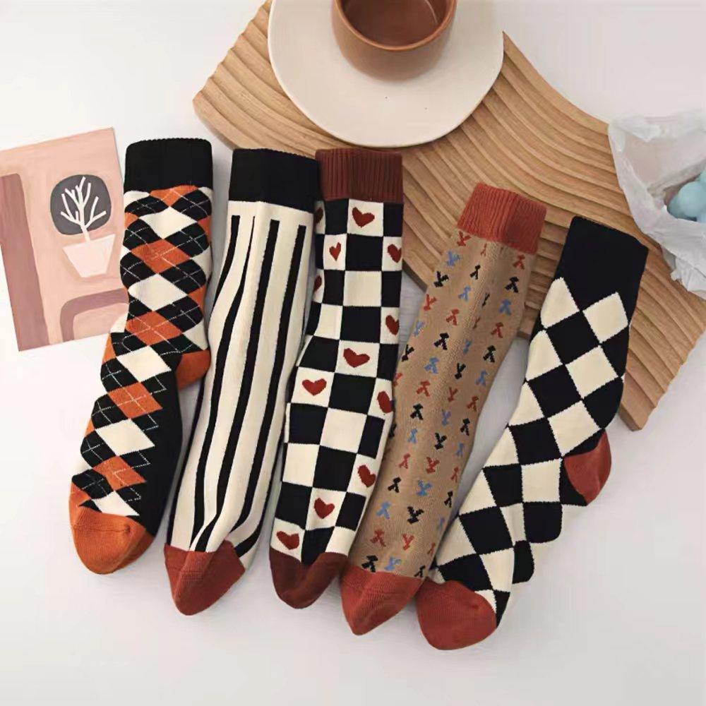 Close-up of five pairs of Thick Retro Socks, easy to pack for travel and errands.
