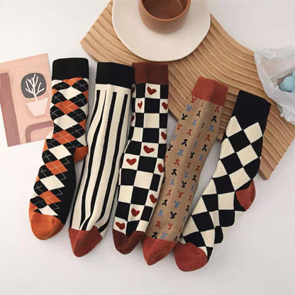 Close-up of five pairs of Thick Retro Socks, easy to pack for travel and errands.