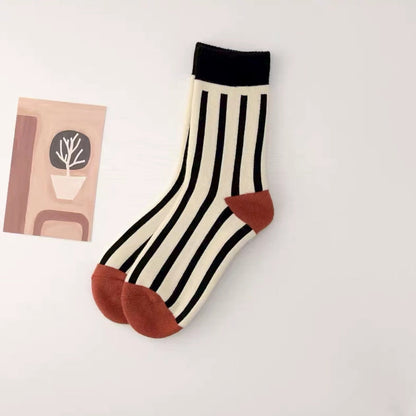 Angled view of Thick Retro Socks with stripe pattern, great for daily wear and lounging.