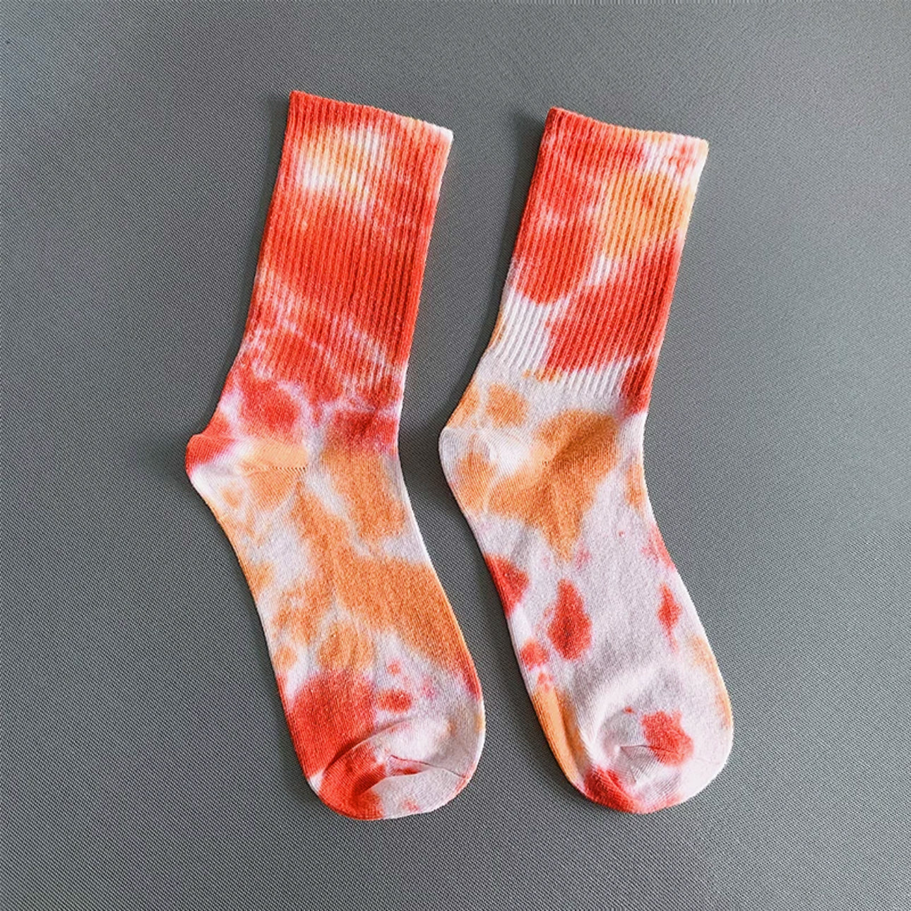 Front view of Tie Dye Cotton Socks in red, easy to pack for travel and errands.