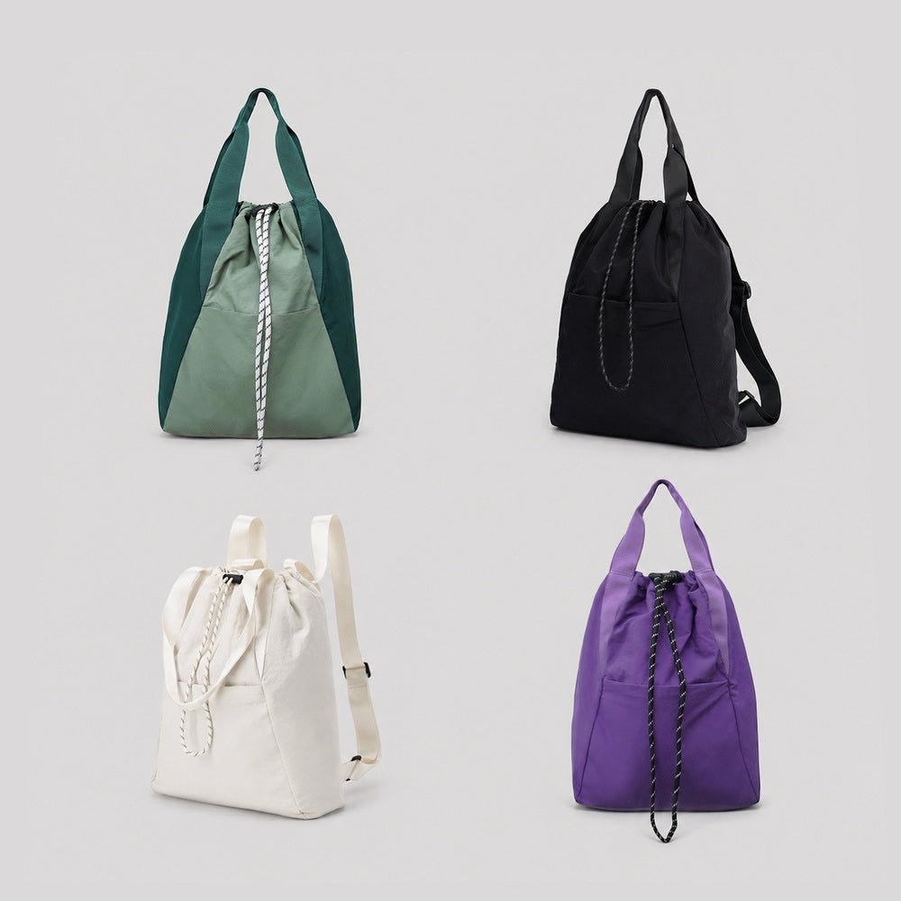 Group display of the ultralight 2-way backpack in green, black, white, and purple.