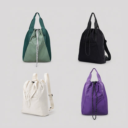 Group display of the ultralight 2-way backpack in green, black, white, and purple.