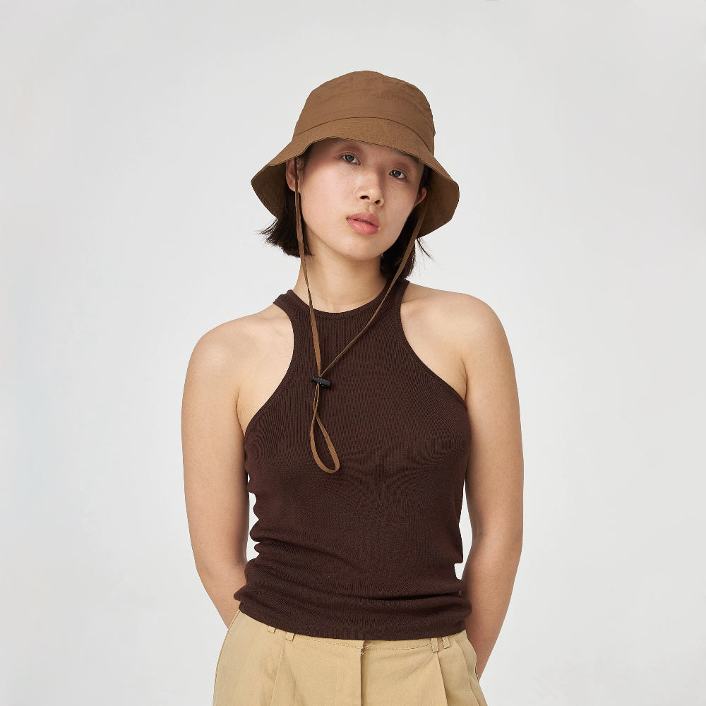 Woman wearing brown nylon ultralight quick-dry bucket hat with an adjustable windproof cord for hiking.
