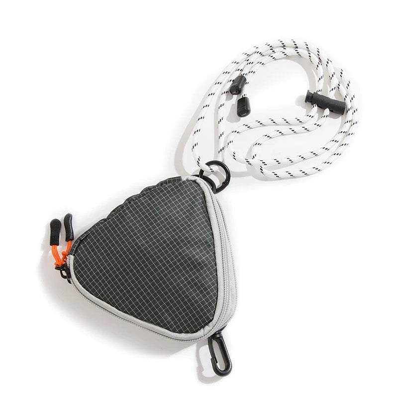 Studio product view of the black triangle nylon pouch featuring a black carabiner clip and white utility cord strap.