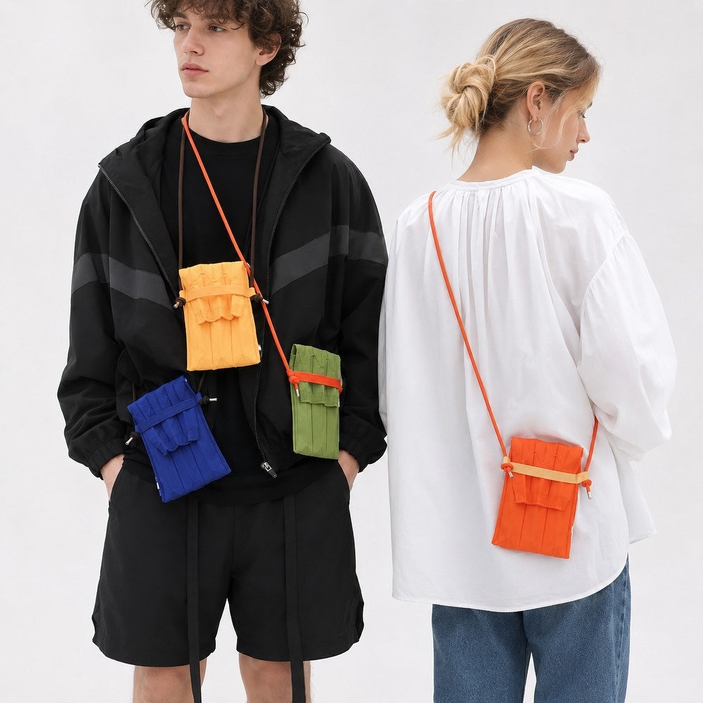 Male and female models wearing the vibrant pleated knit mini crossbody bags in blue, orange, yellow, and green.