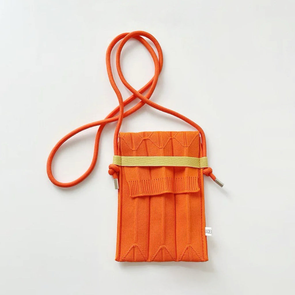 Front view of Vivid Knit Pleat Mini Bag in orange, ideal for errands and gifting.