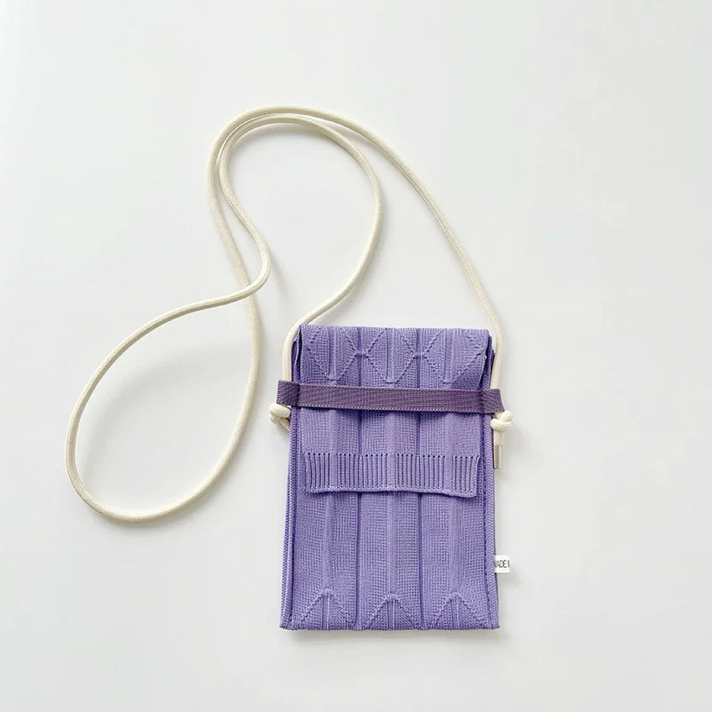 Angled view of Vivid Knit Pleat Mini Bag in purple, ideal for errands and gifting.