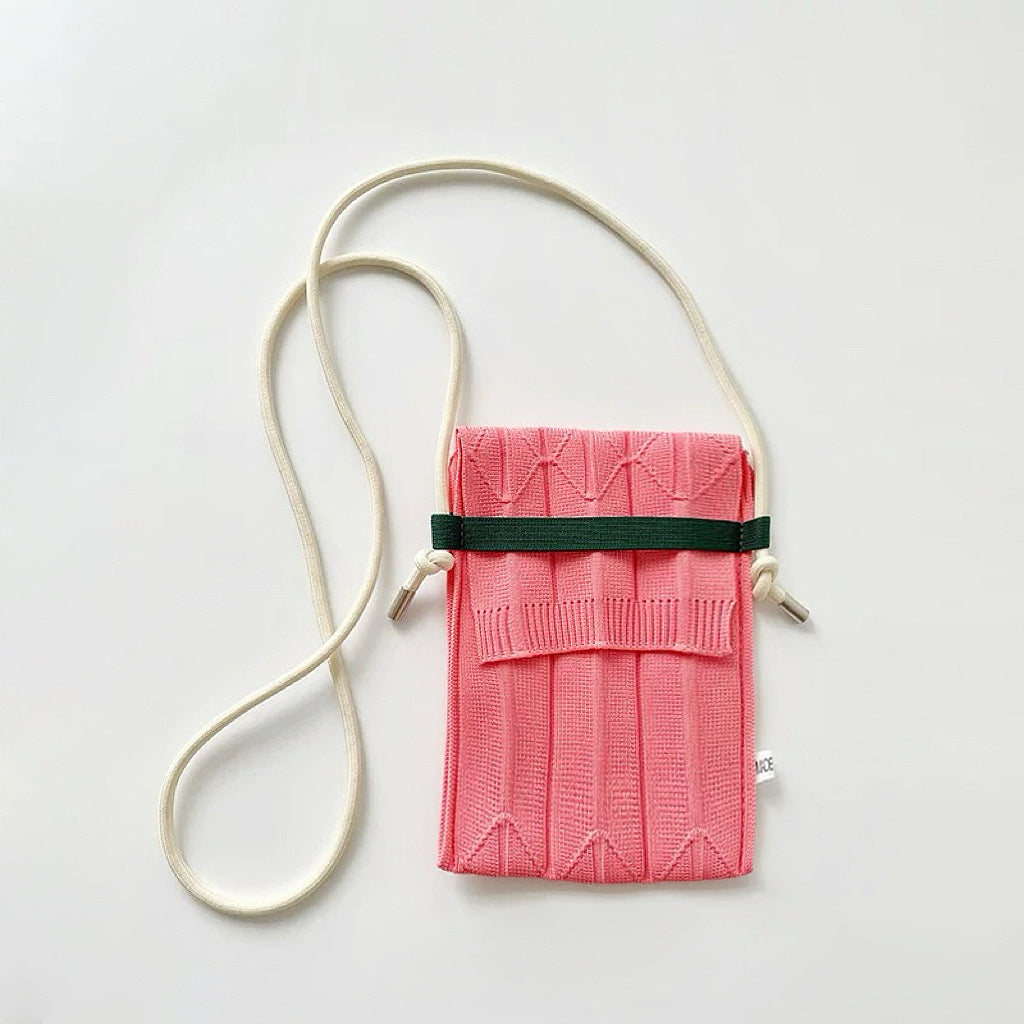 Close-up of Vivid Knit Pleat Mini Bag in pink, easy for commuting and weekends.