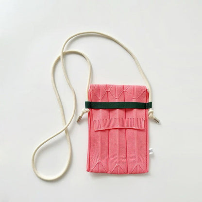 Close-up of Vivid Knit Pleat Mini Bag in pink, easy for commuting and weekends.