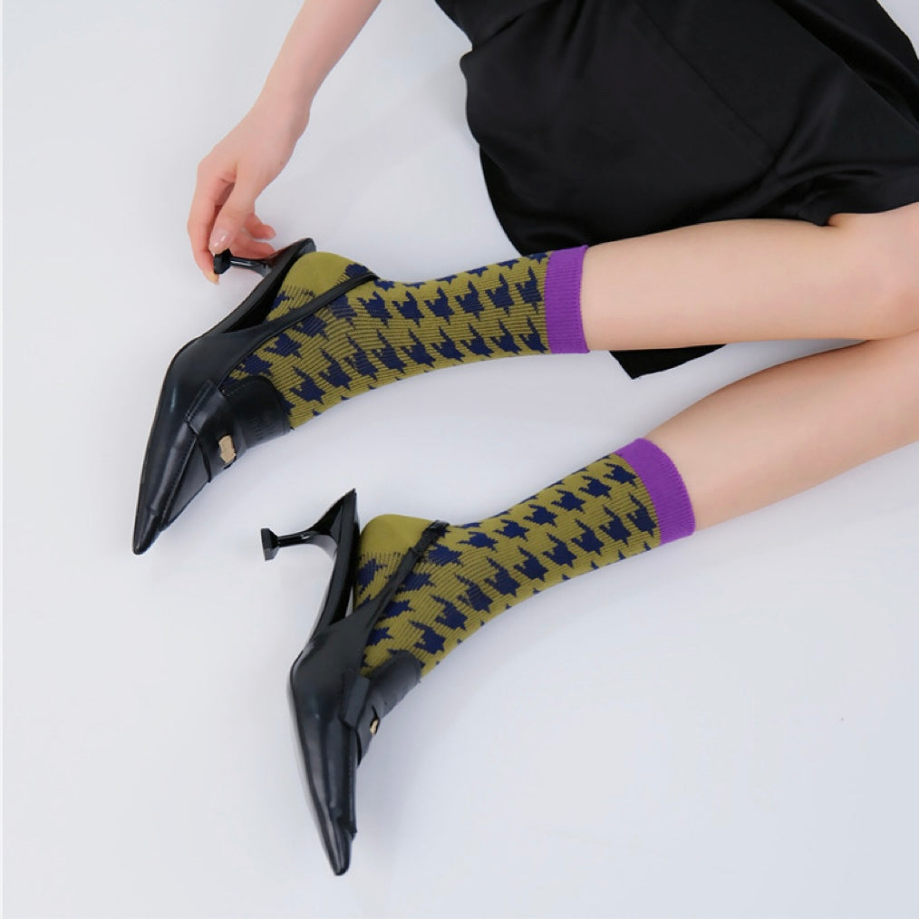 Model wearing a pair of  Wild Birds Socks, great for casual wear and light workouts.