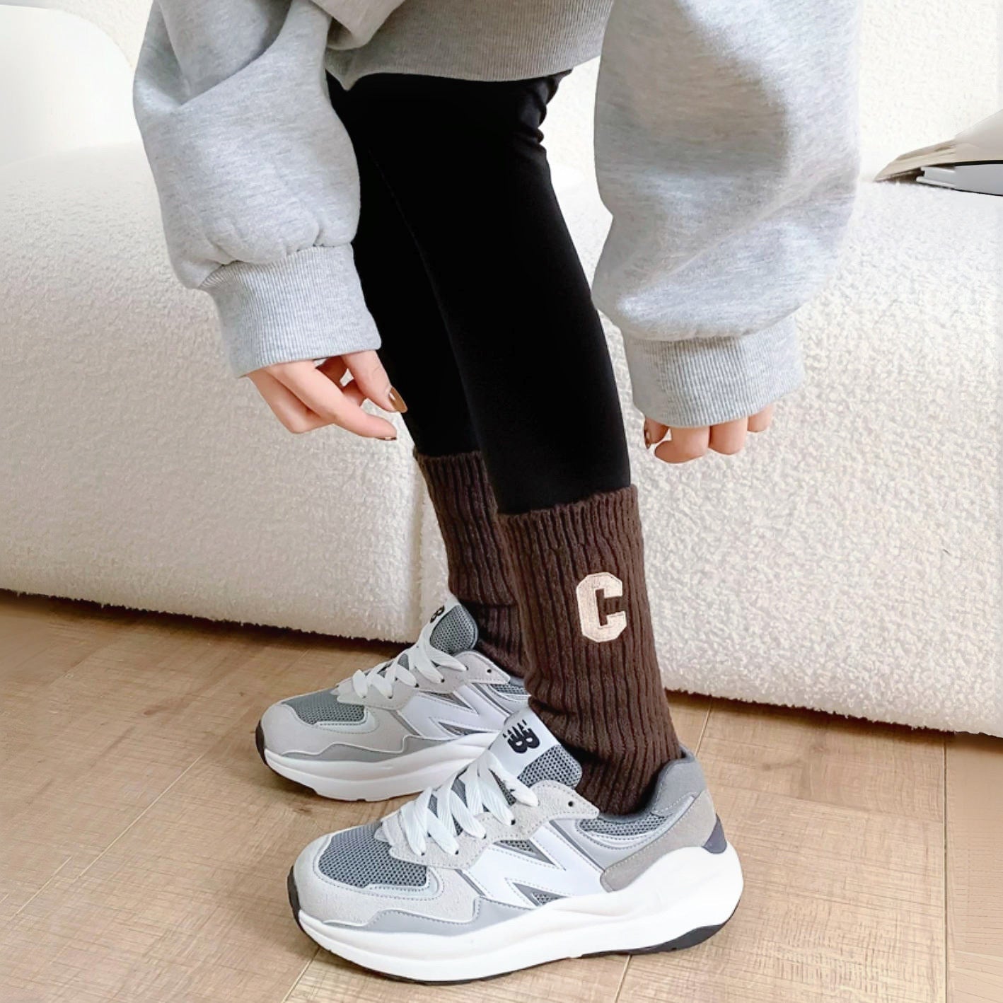 Model wearing a pair of brown wool socks, great for casual wear and light workouts.